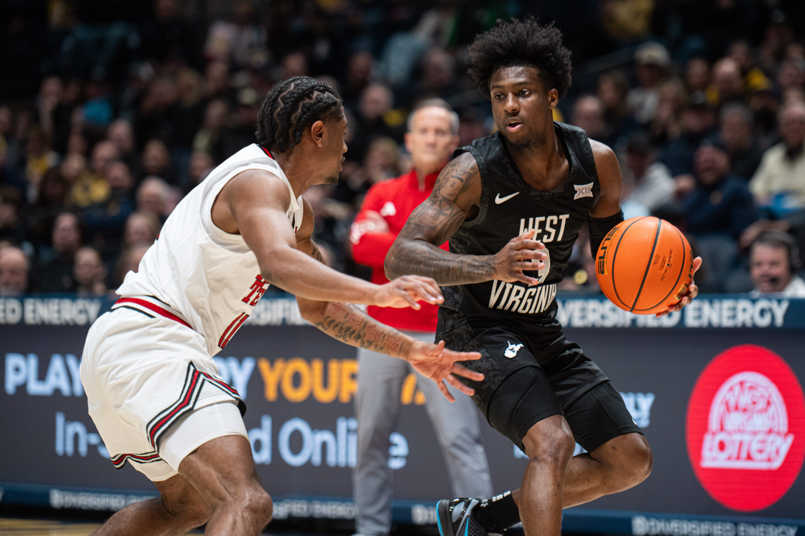 No. 13 Texas Tech drains 13 3-pointers on its way to a 70-63 victory against WVU